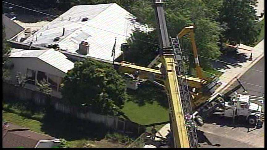 Crane Tips Over and Slams into Two Mobile Homes