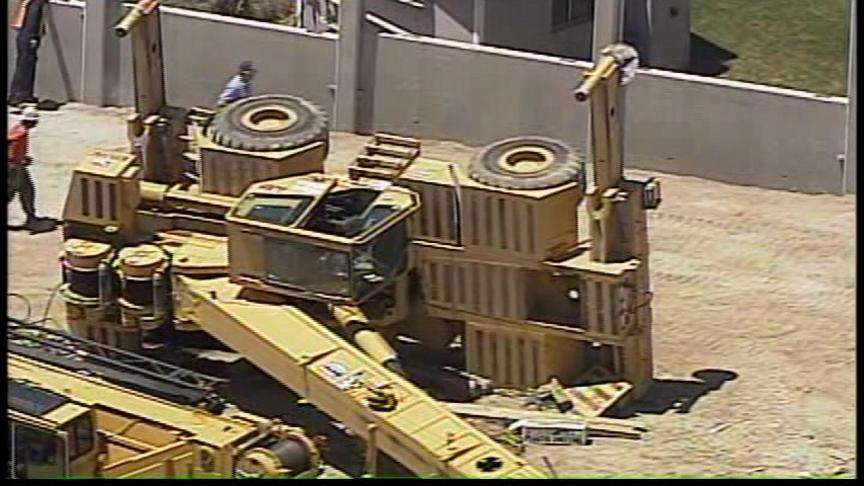 Crane Tips Over and Slams into Two Mobile Homes