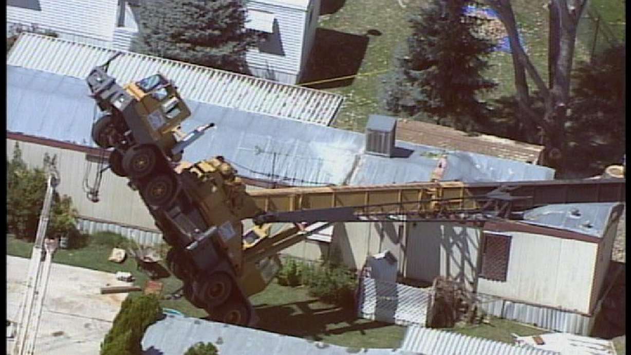 Crane Tips Over and Slams into Two Mobile Homes