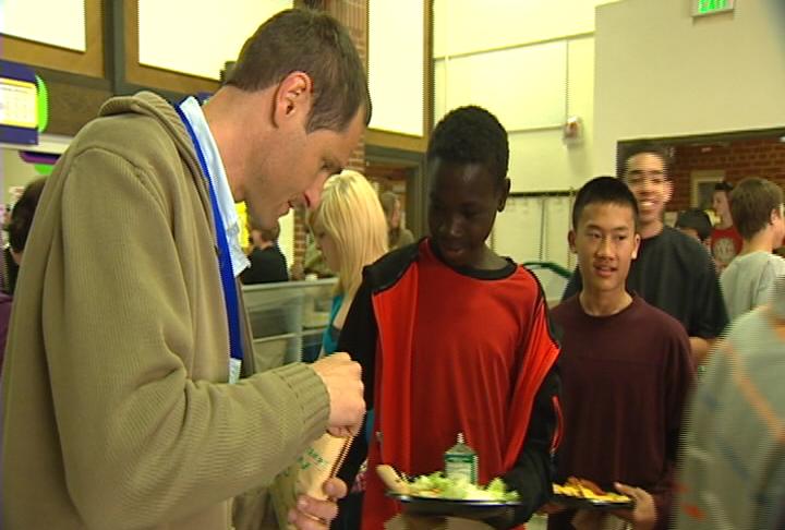 Jr. high teacher motivating students to eat healthy