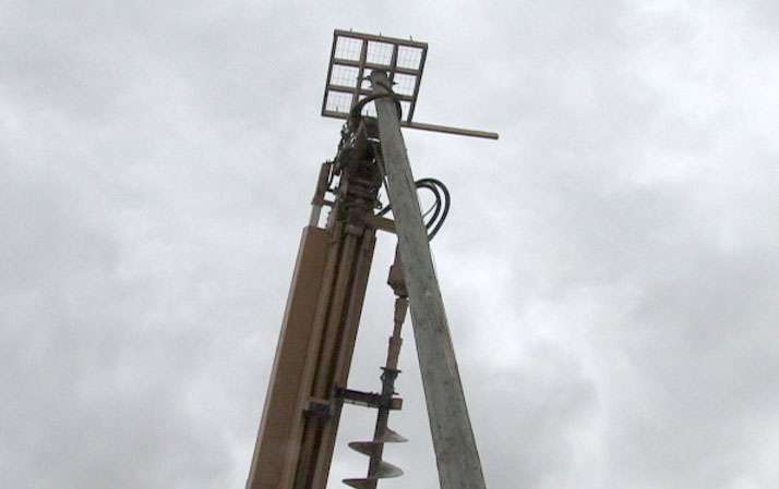 A platform is installed on top of the poles for the hawks to nest.