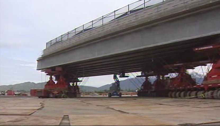 One of the bridges has already been set on the self-propelled modular transports, which will move it into place.