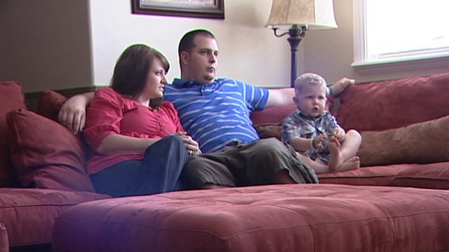 Stephanie (left), Steve (middle) and Rex Stuart (right)watch "Toy Story" together.
