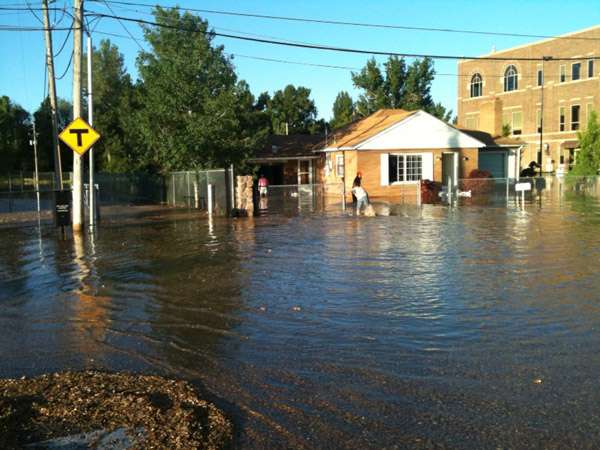 Floodwaters from Little Cottonwood Creek submerged parts of State Street, Murray Park and many residences in Murray.