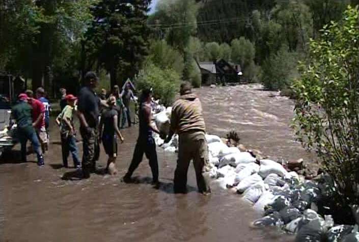 Volunteers worked to protect residences in Oakley after the Weber River raged out of control.