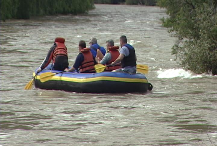 John Volt and four friends got into a large raft near the Croydon bridge Thursday to take advantage of all the water