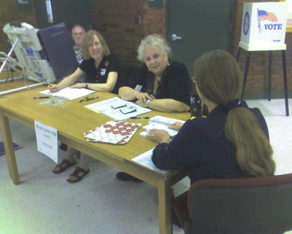 At slow polling locations, election officials were left to work on word puzzles and chat.