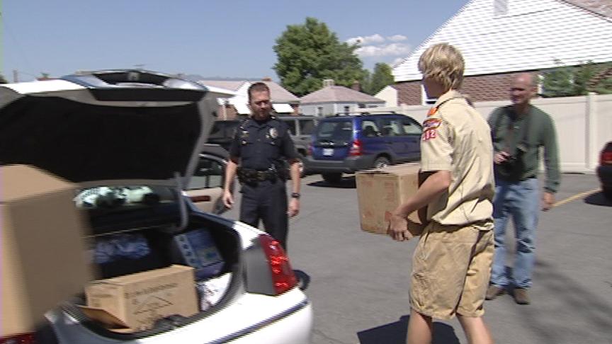 Scout Donates Books to Police Dept.