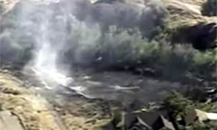 Brush Fire Burns Near Homes in Sandy