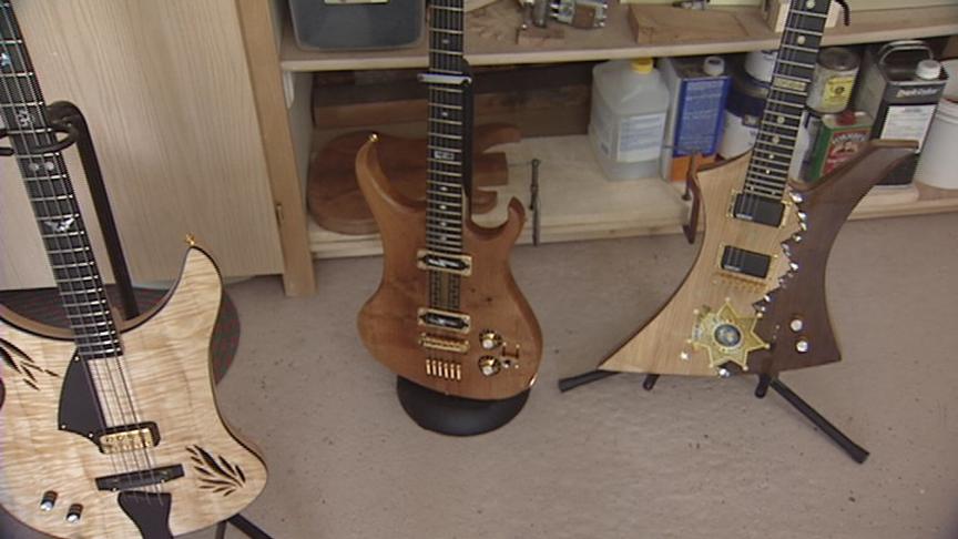 Dave Jorgensen's Paul McCartney guitar (left), "high-voltage" guitar (middle) and sheriff's office guitar (right).