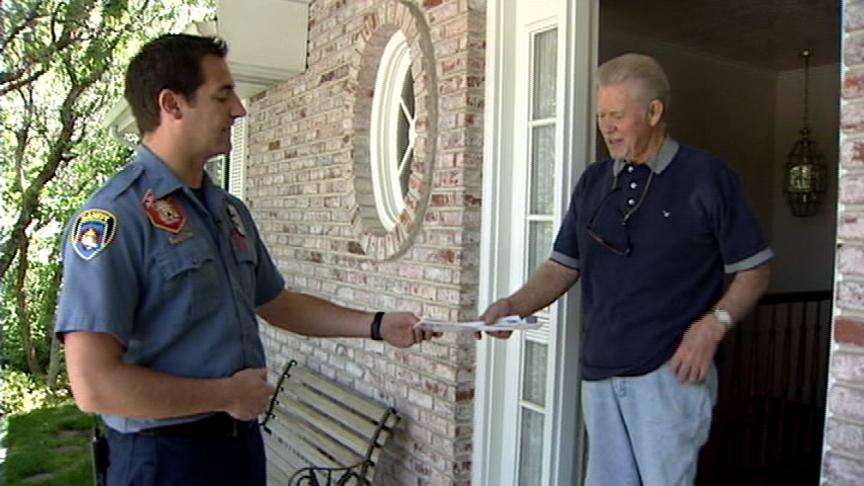 Sandy firefighters went door to door handing out pamphlets to help residents prepare for a wildfire.