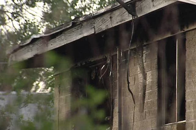 Woman jumps from window to escape house fire