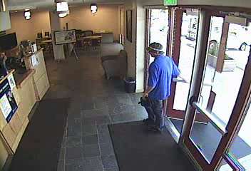 Surveillance photo of the robber entering the Deseret First Credit Union in Provo.