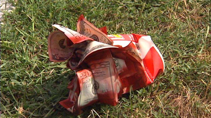 The two were found when they were spotted by another motorist who saw them throw money stained with dye out of one of the car's windows.