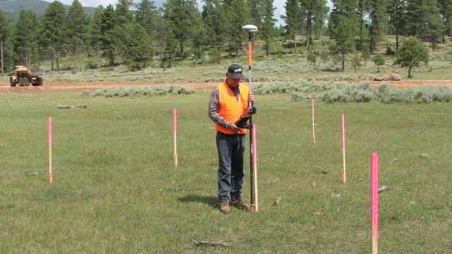 Darin Taylor surveying.