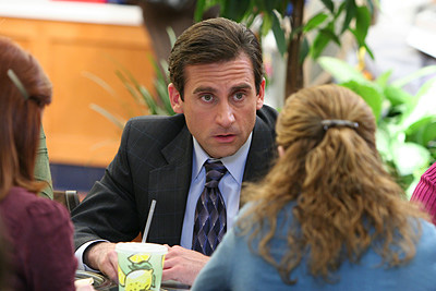 Business People Watching "The Office" for Tips