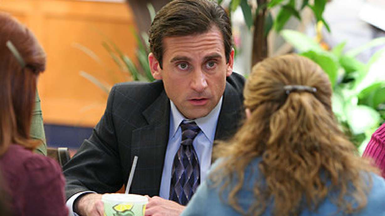 Business People Watching "The Office" for Tips