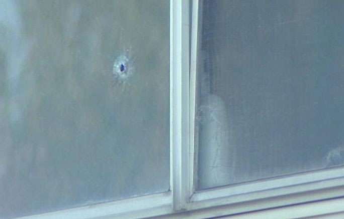 A few of the bullets made it inside the house, but none of the three occupants were injured.