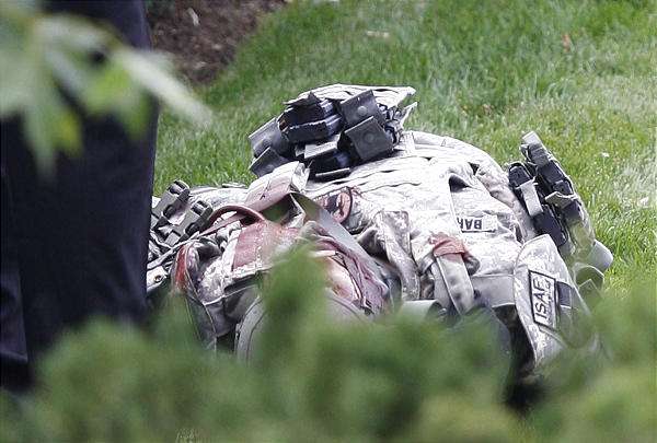 A man lies dead after shooting a police officer in the leg outside of the Grand America Hotel in downtown Friday in Salt Lake City. (Tom Smart, Deseret News)