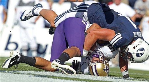 BYU's Jordan Pendleton tackles Washington's Jermaine Kearse. (AP Photo/George Frey)