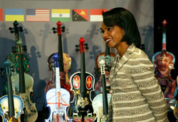 U.S. Secretary of State Condoleezza Rice listens to Utah student artists describe the violin they painted during a showing of violins painted by artists from countries around the world for the Strings of Diplomacy exhibit, Tuesday, Aug. 29, 2006 in Salt Lake City. Three Salt Lake City tenth grade students painted the violin representing the United States over a two year period starting when they were in eighth grade. Rice is in Utah for the American Legion Convention. (AP Photo/Steve C. Wilson)