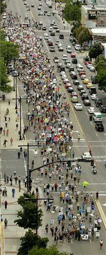 Thousands of protestors march down State Street to the Utah federal building during an anti-President Bush rally Wednesday, Aug. 30, 2006, in Salt Lake City. They presented the offices of senators Orrin Hatch and Bob Bennett, and Rep. Rob Bishop, all R-Utah, with a symbolic indictment of President Bush and Congress for the war in Iraq. (AP Photo/Douglas C. Pizac)