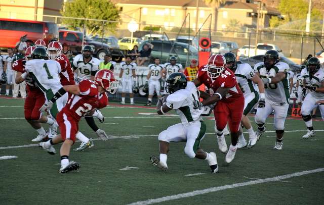 Dixie's Keauntea Bankhead gets a rare hold on Humboldt State's Lyndon Rowells (Levi Arnone/Dixie Sun)
