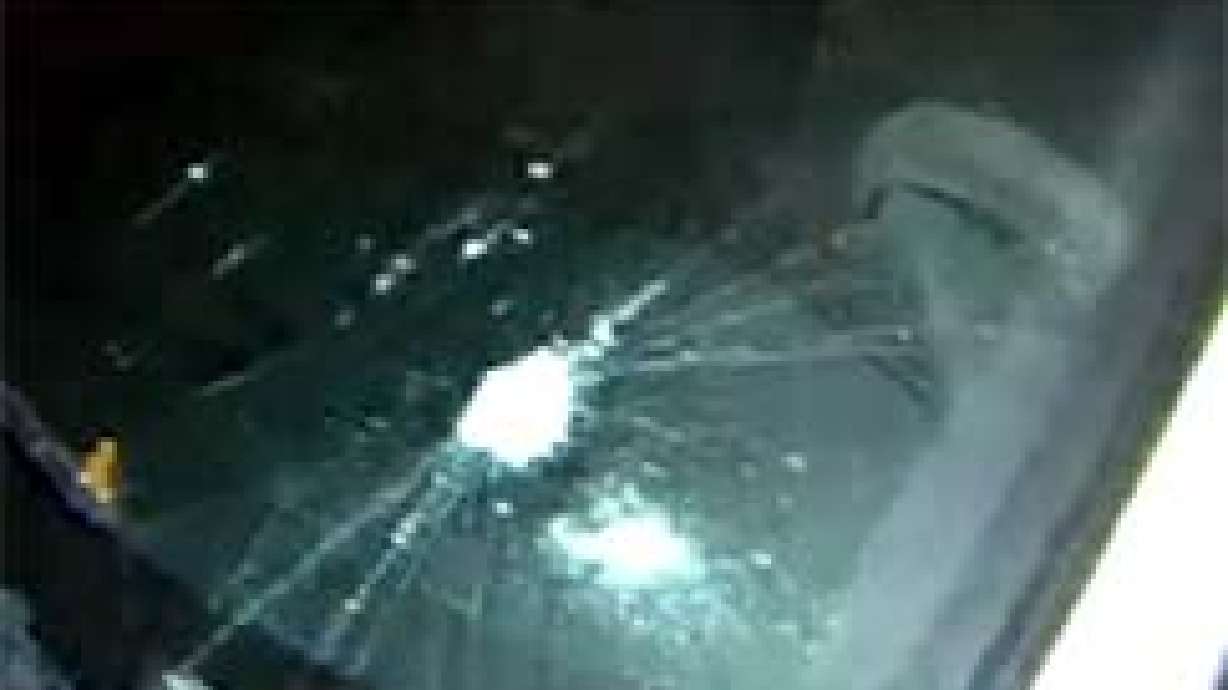 Car Owners Cleaning Up After Vandalism