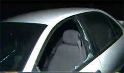 Car Owners Cleaning Up After Vandalism