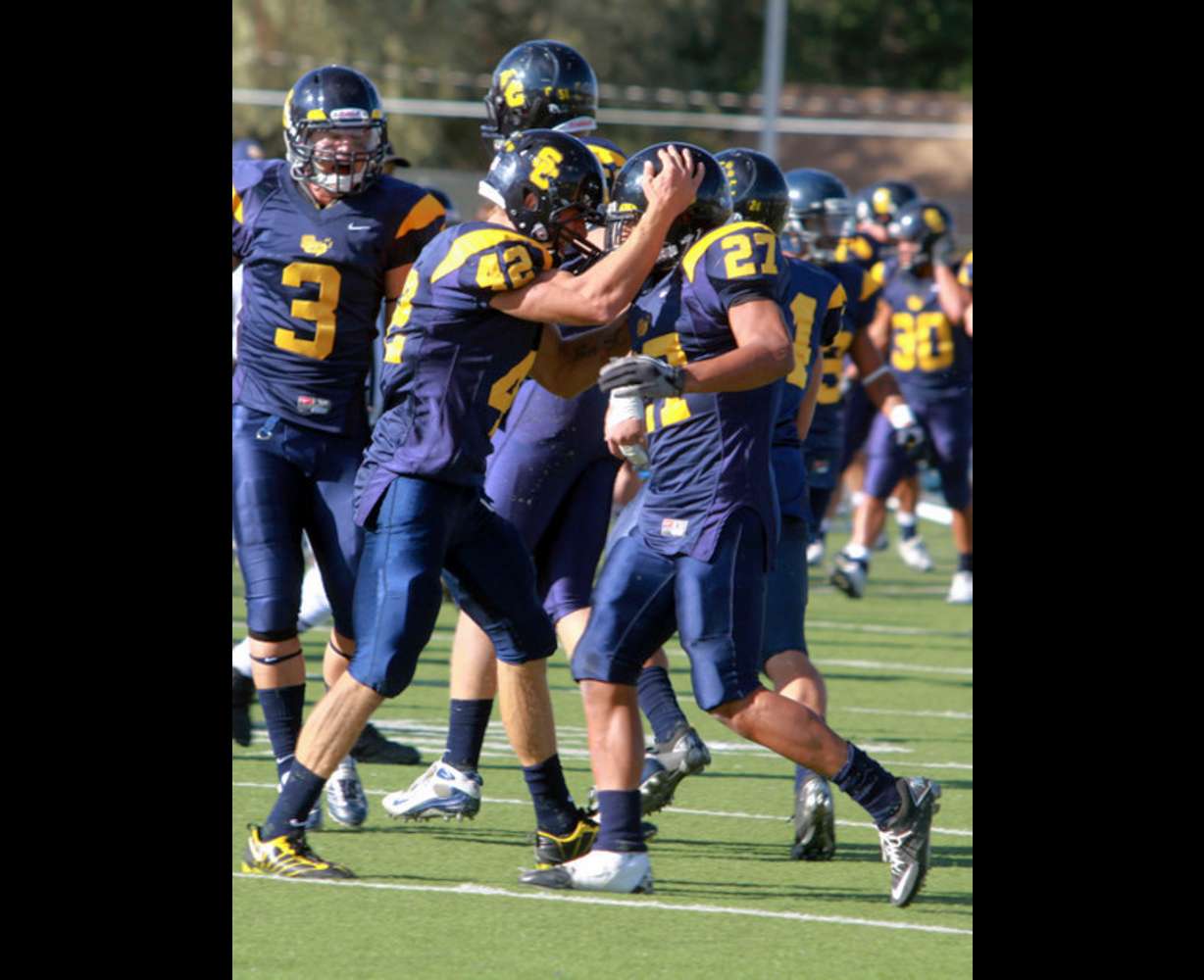 Snow captain Preston Hadley celebrates with a teammate. (Greg Dart/Snow College)