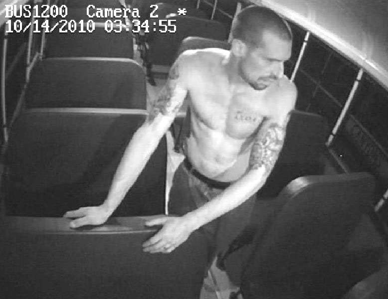 The is is pictured shirtless, revealing several tattoos on his arms and another on the left side of his chest.