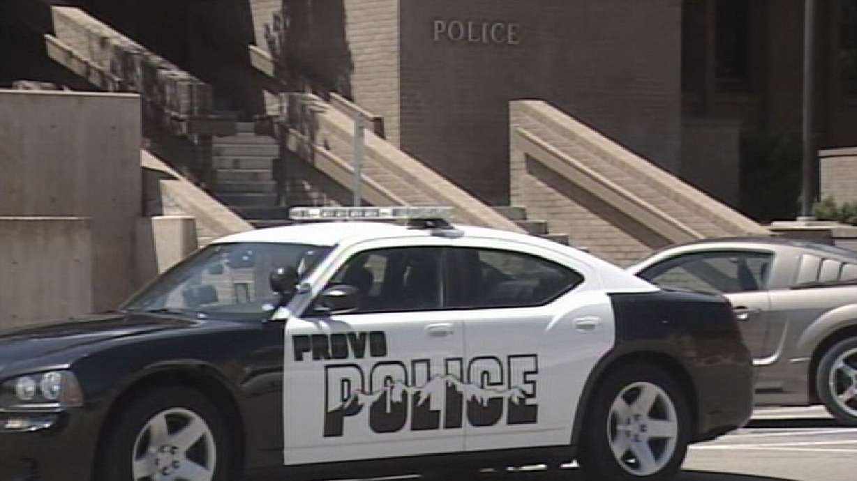 Provo officer denies pointing gun at woman
