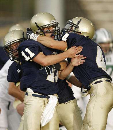 Skyline's Michael Pell celebrates a touchdown against Olympus. (Jeffrey D. Allred, Deseret News)