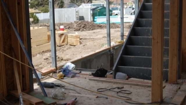 Matt Christensen tripped on a bolt and fell into a stairwell where the stairs were not yet in place.