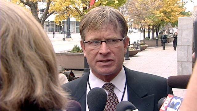 Salt Lake City police officer Jon Richey talks to reporters outside the Federal Courthouse Wednesday.