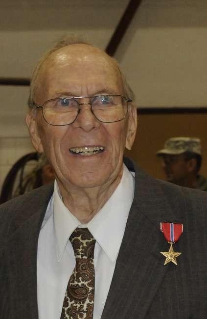 World War II veteran Richard J. Johnson wears the Bronze Star that was officially pinned on him Friday, Nov. 19, 2010. He was awarded the medal for rescuing an injured soldier during the Battle of the Bulge Jan. 10, 1945.