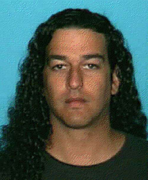 Authorities say Lance Leeroy Arellano may have long hair now, similar to this mugshot taken in 2002