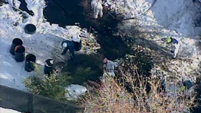 Crews work to clean up oil Thursday that leaked from a Chevron pipeline near Red Butte Creek.