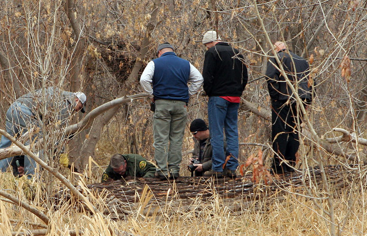 Investigators on Tuesday were digging up guns and explosives possibly related to the case in Remember the Maine Park in Dry Fork Canyon, northwest of Vernal.
