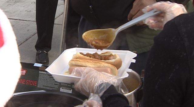 Families serve up chili dogs at homeless shelter