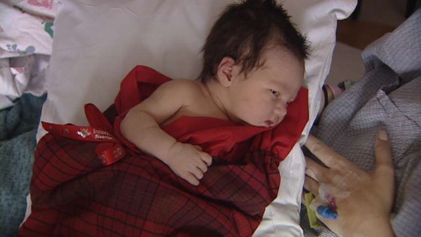 Baby sized ELF brings family big sized holiday joy