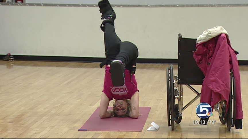 Yoga instructor doesn't let broken legs keep her from teaching