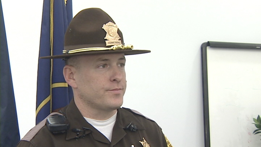 Trooper, motorists almost hit on I-215