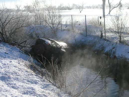 A Tooele man went off of state Route 201 Sunday morning, rolling his sport utility vehicle into three feet of water in a nearby drainage canal. The crash happened about 7:53 a.m. near 8600 West. (Photo courtesy Utah Department of Public Safety)