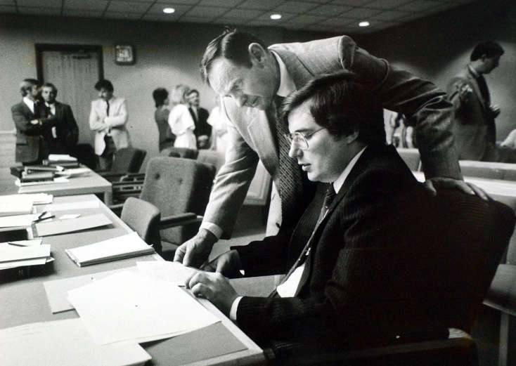 Mark Hofmann with father William during preliminary hearing April 15, 1986. Ravell Call/Deseret News