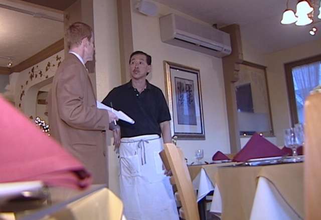 Yamasaki restaurant owner Steve Louie (right) tells KSL's Jed Boal (left) about the strange phone call he received.