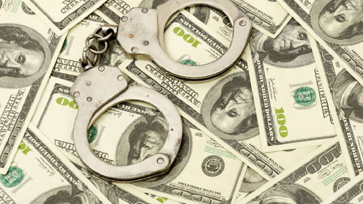 Ex-Utah State exec arrested in scholarship scam
