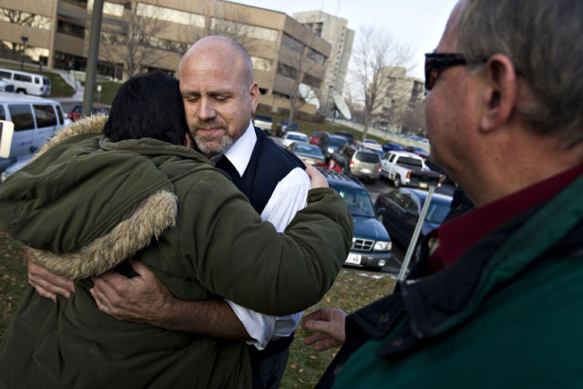 At a rally where dozens of supporters gather, Beau Babka arrives and hugs former co-worker Marilee Jensen at the Salt Lake County Government Center on Wednesday, Jan. 26, 2011. (Mike Terry, Deseret News)