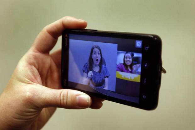 Sarah Parker, market insight manager with Sorenson Communications, holds the new "ntouch Mobile" technologies that empower deaf individuals to place calls while on the go Thursday, Feb. 10, 2011, in Salt Lake City.
(Tom Smart, Deseret News)