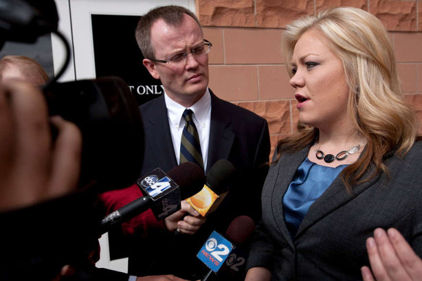 Washington County Prosecutor Brock Belnap looks on as Elissa Wall, right, answers questions from the media outside 5th District Court Friday, Feb. 18, 2011 in St. George, Utah. (AP Photo/The Spectrum, Jud Burkett)